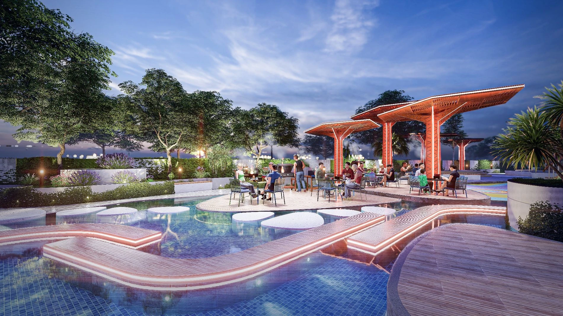 Các gia đình đang tổ chức tiệc nướng tại khu BBQ ngoài trời được thắp sáng rực rỡ vào ban đêm tại Thảo Điền Green.